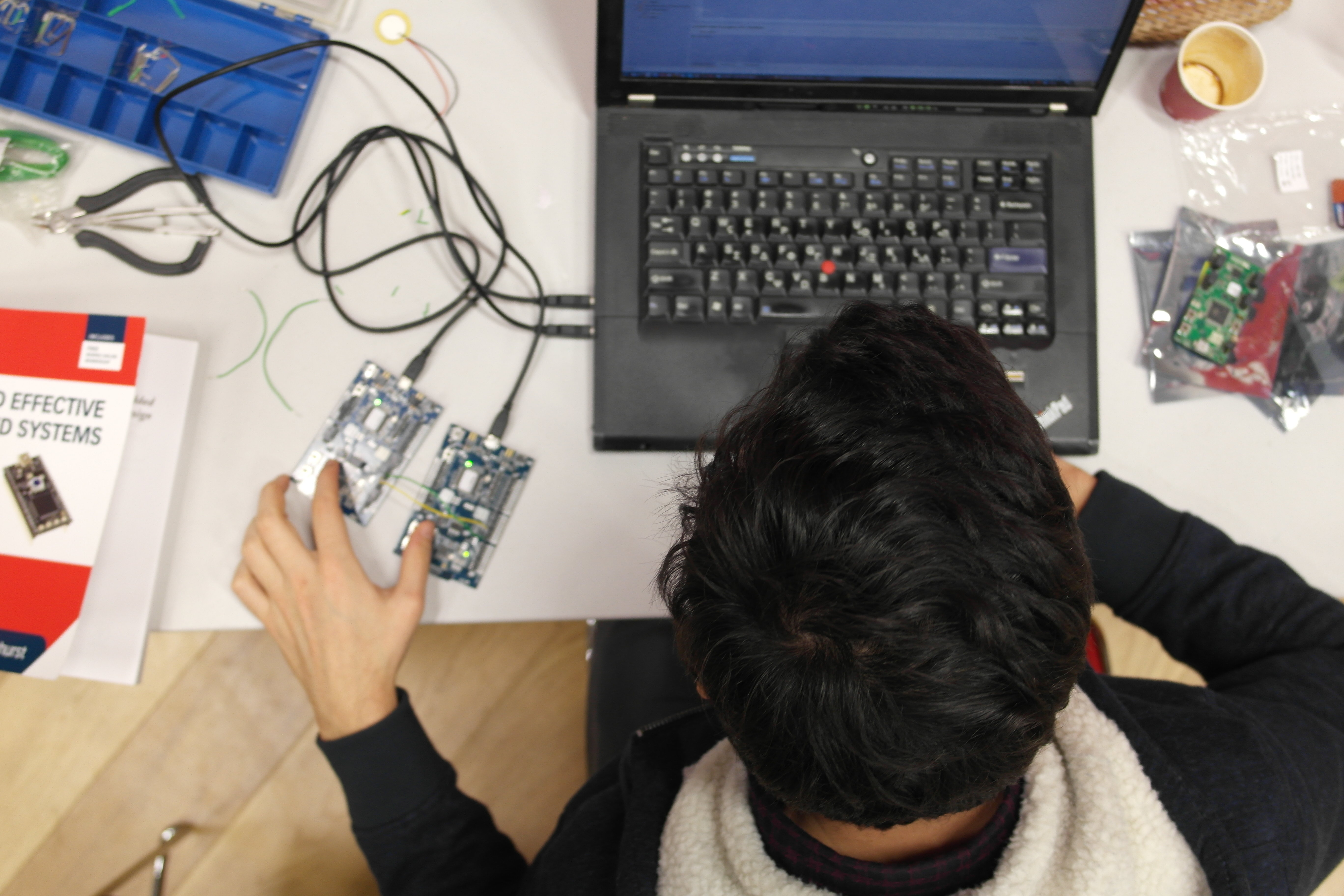 A child using a computer as part of an arts and technology project organised by Collusion