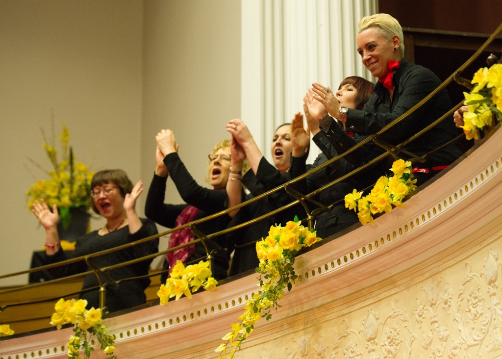 Participants at Batley does Opera applaud the performance from a balcony.