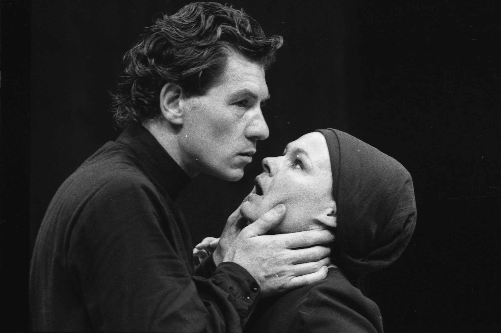 A black and white photograph of Ian Mckellen and Judi Dench performing onstage in Macbeth, in 1976
